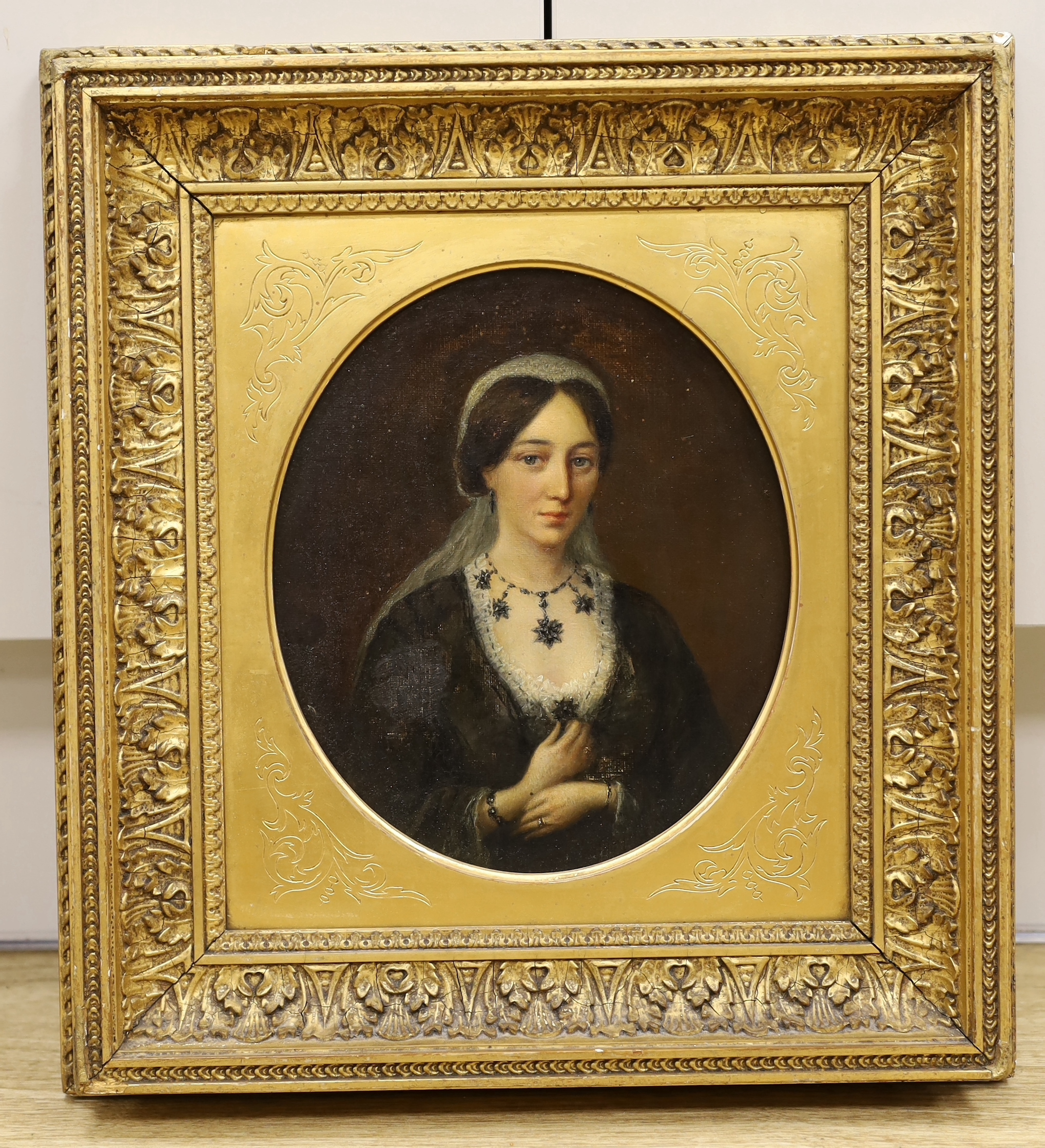 19th century oil on canvas, Portrait of a lady wearing a head-dress, Windsor & Newton, London stamp verso, 22 x 18cm, oval gilt frame